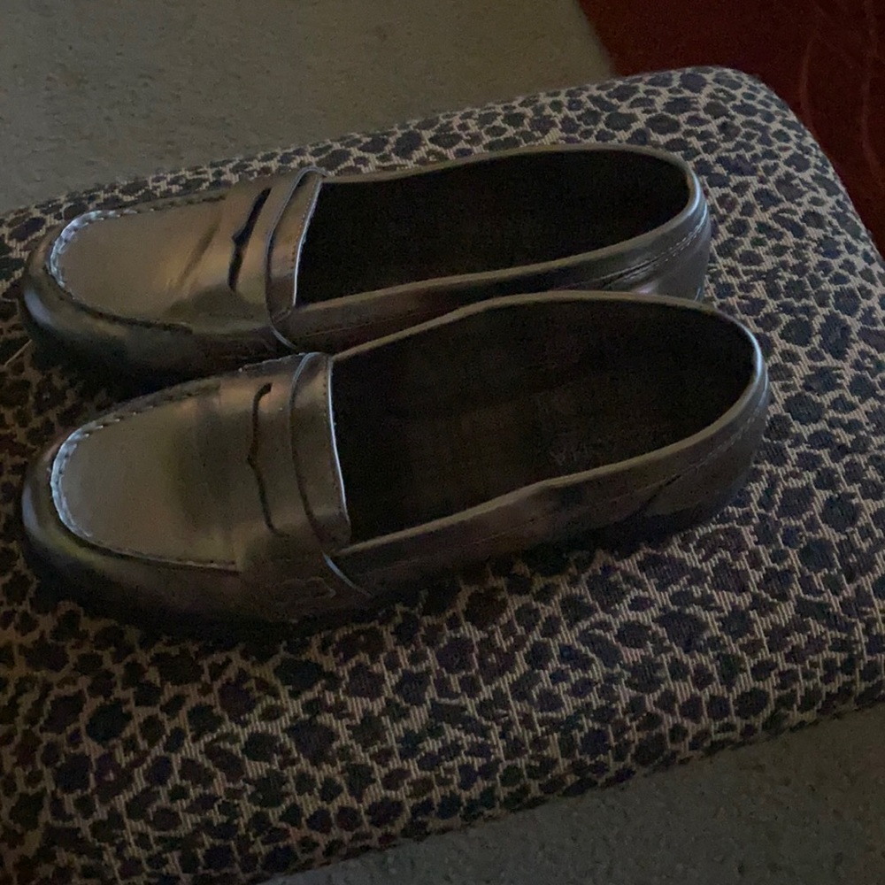 This is a silver loafer shoes